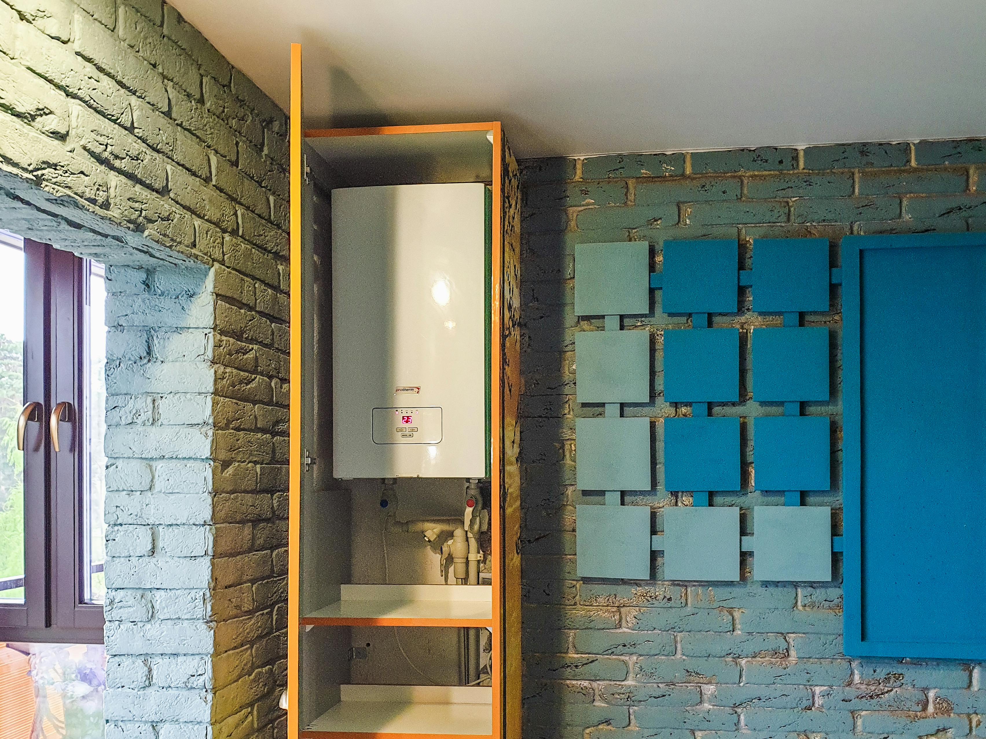 Compact boiler installation in bathroom by Timeless Bathrooms, Cardiff – discreet, efficient setup by Gas Safe registered installer.