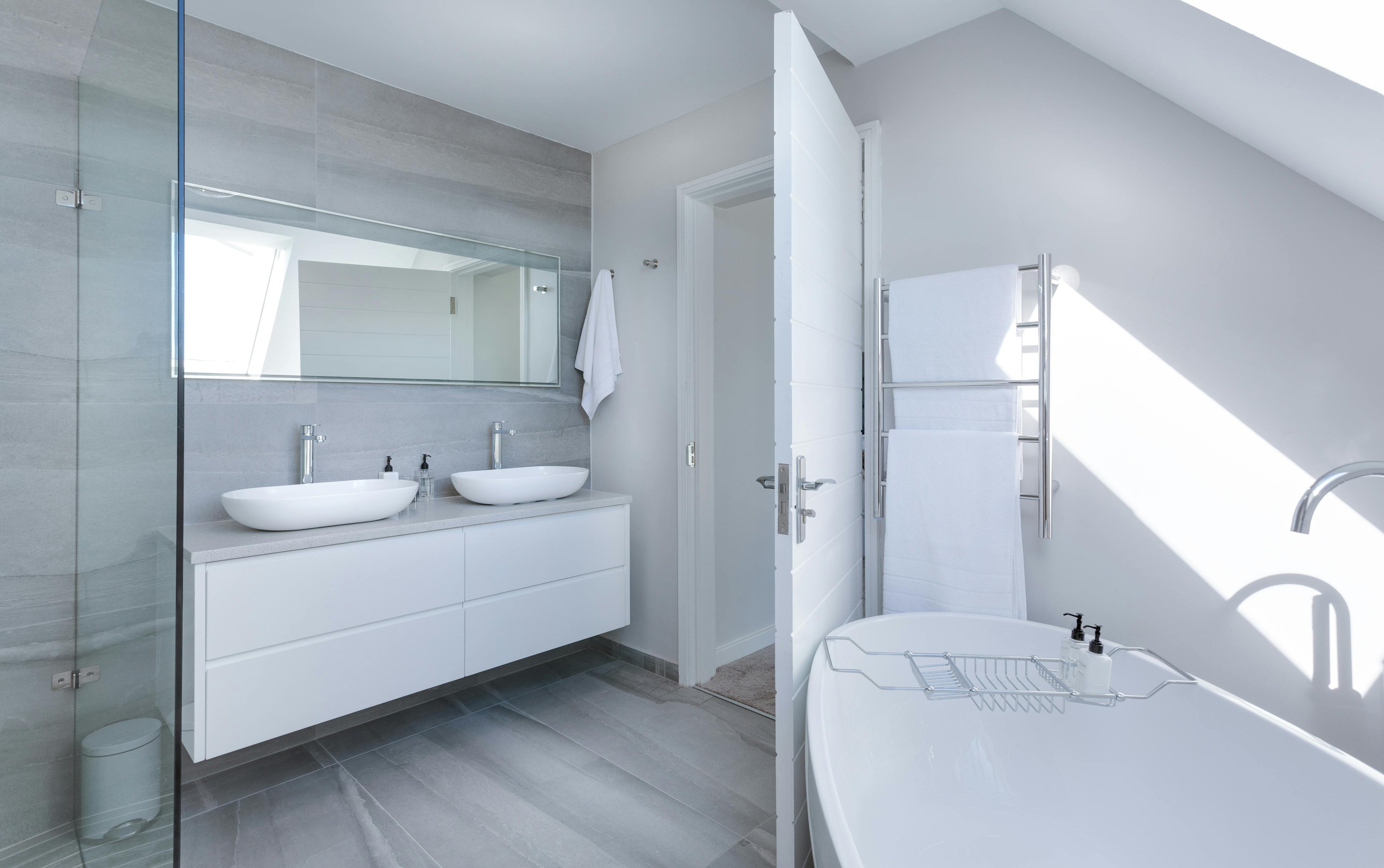 Modern white bathroom design by Timeless Bathrooms in Vale of Glamorgan – clean, minimalist finish with expert installation